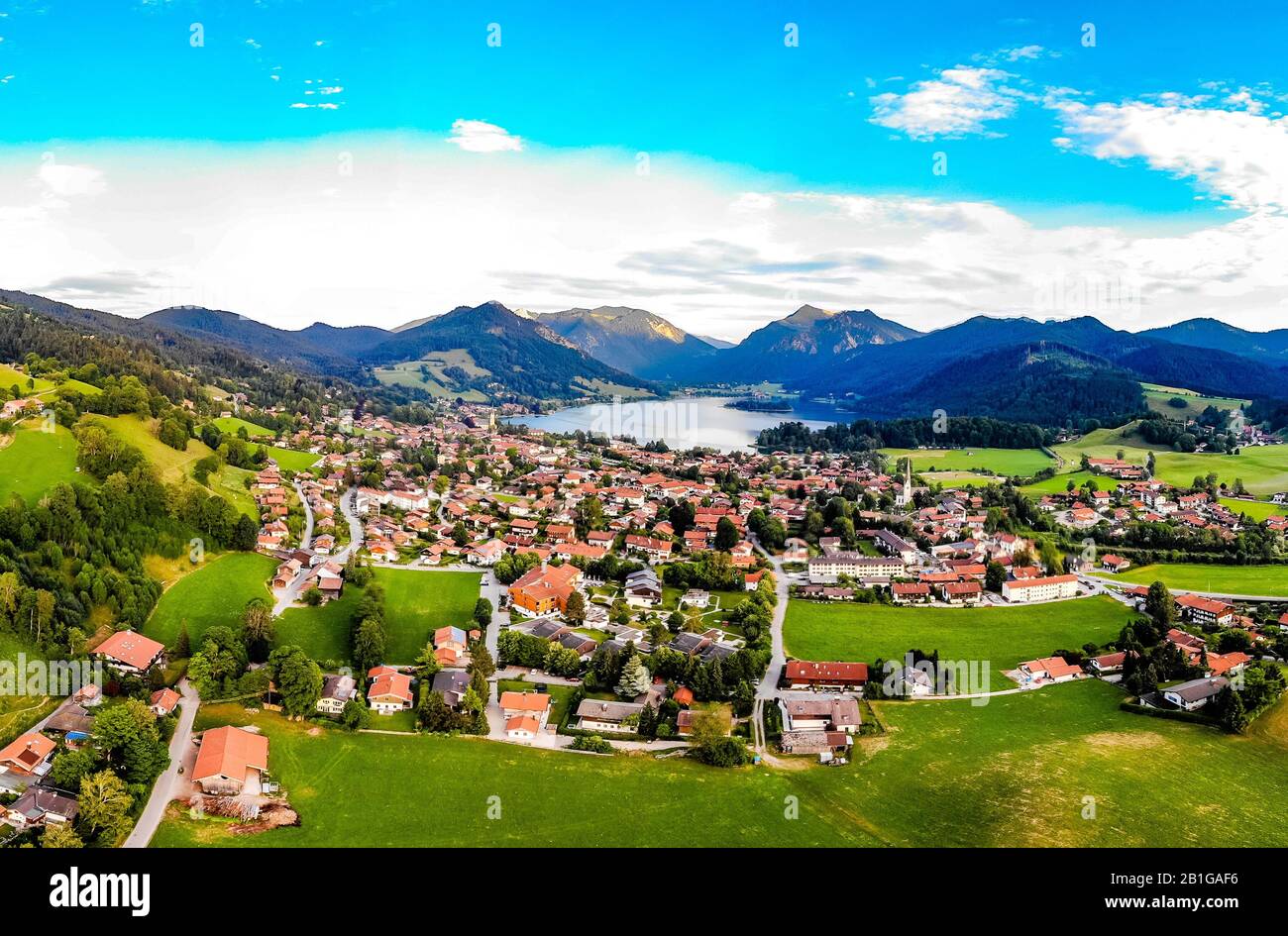 Beatuful aerial panorama view on Schliersee lake, town, village, alps mountains, blue sky, clouds. Bavaria, Bayern, nearby Munich, Rosenheim. Germany Stock Photo