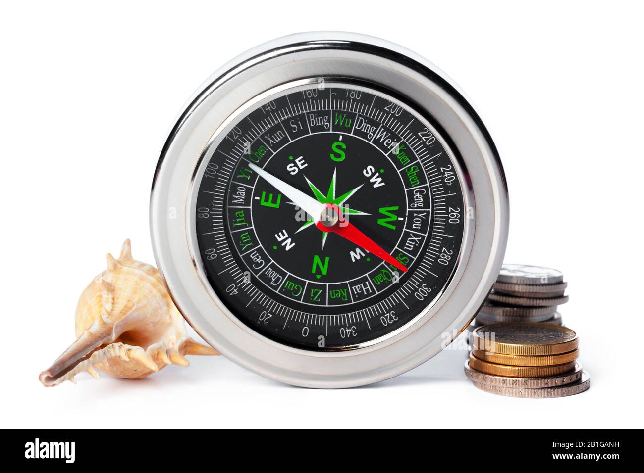 sea shells and old compass with sand isolated on white background ...
