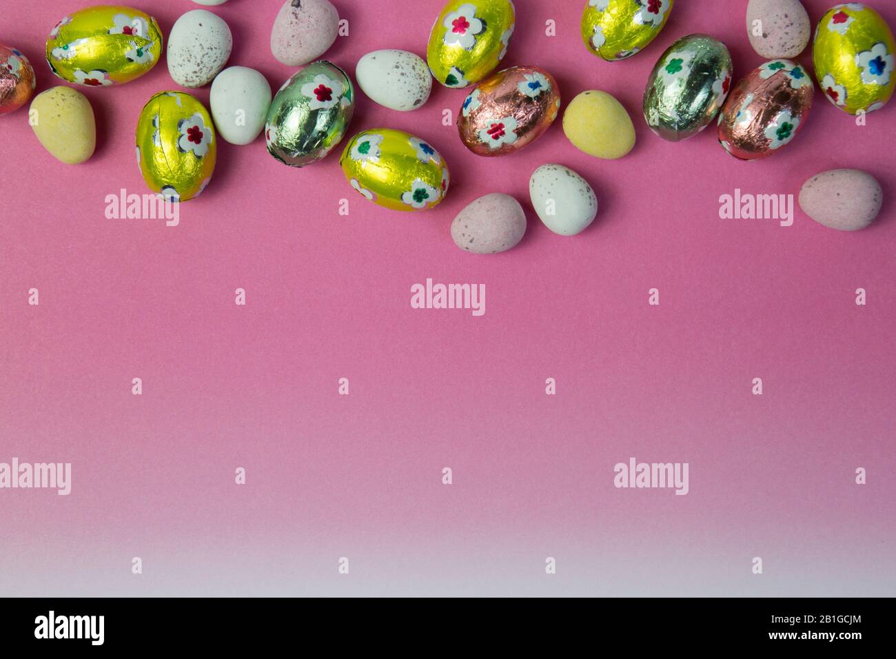 Easter egg flat lay on pink background with copy space. Spring holiday ...