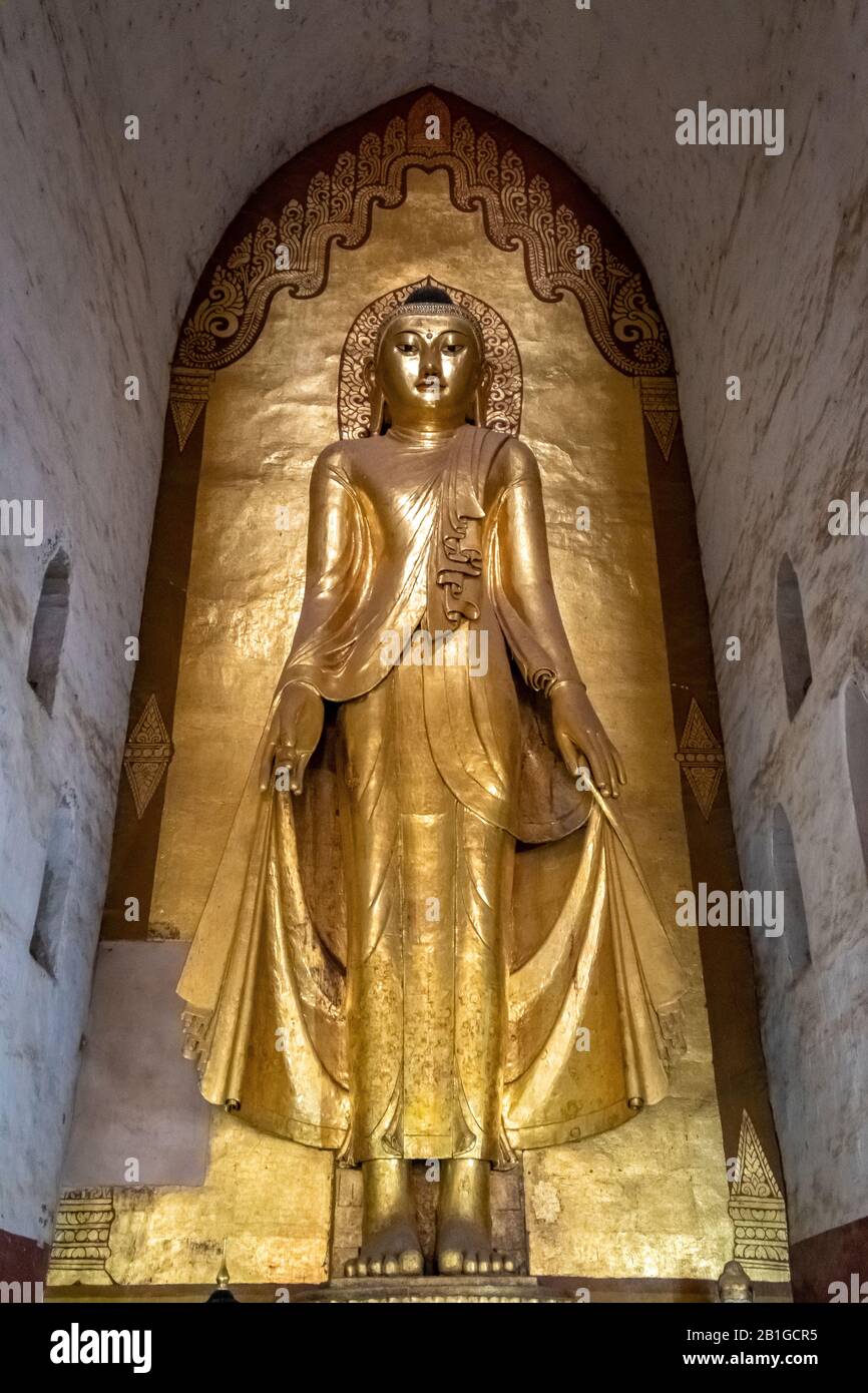 Standing Buddha statue at Ananda Pagoda, Bagan, Mandalay Region, Myanmar Stock Photo