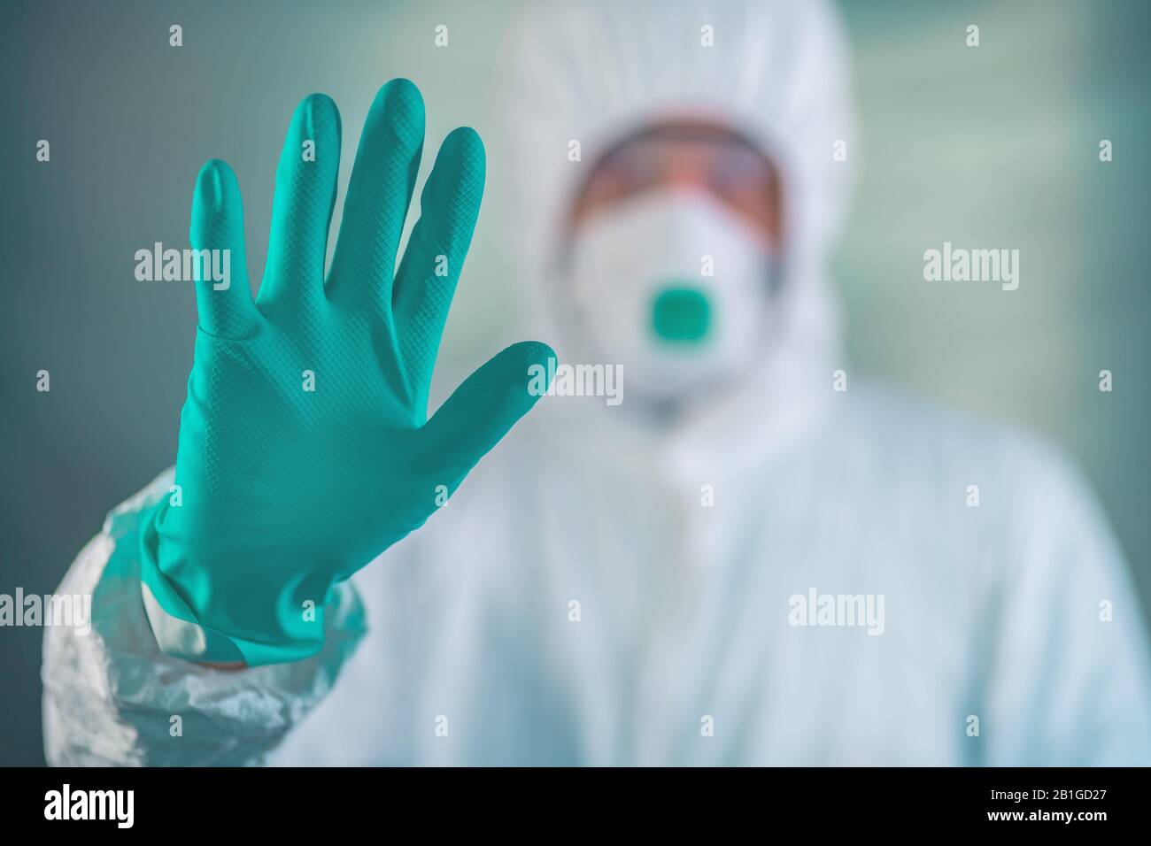 Epidemiologist gesturing Stop hand sign in coronavirus quarantine, selective focus Stock Photo