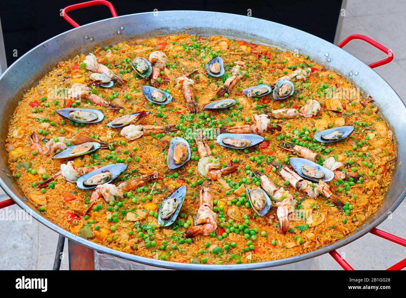 Spanish paella live cooking station, delicacy from Spain Stock Photo