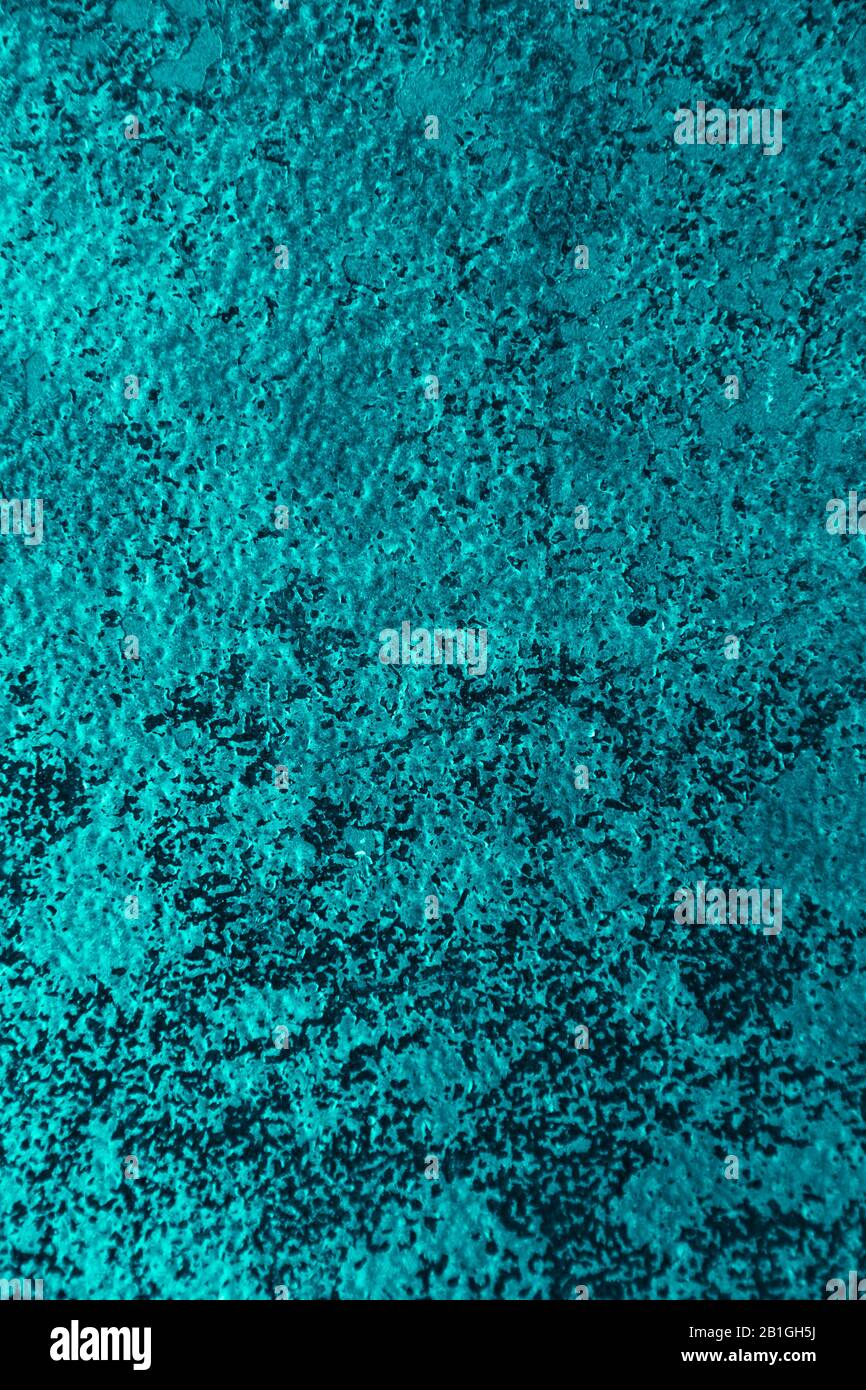 Rusty metal wall, old sheet of iron covered with rust with multi-colored paint vertical background texture. Stock Photo