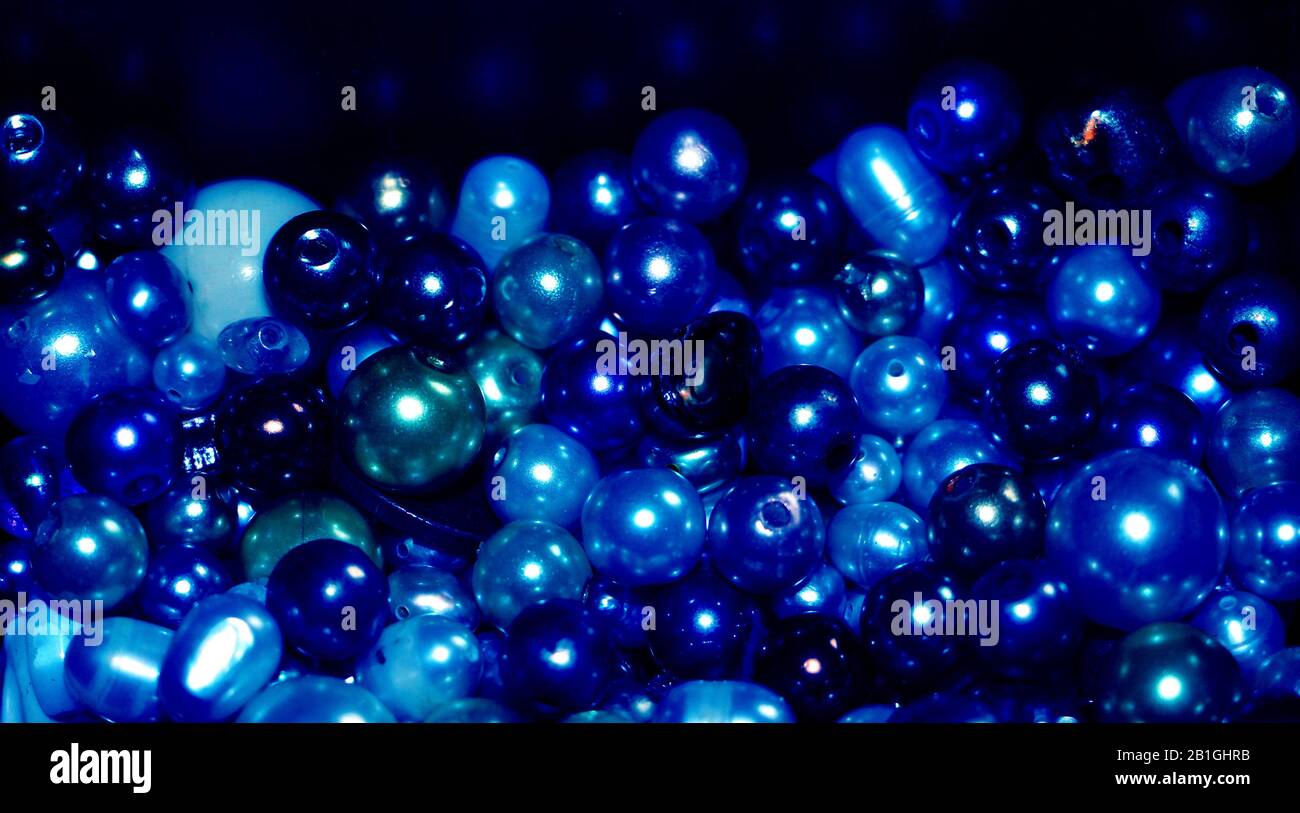 Blue pearls and beads background made of different kinds of beads Stock
