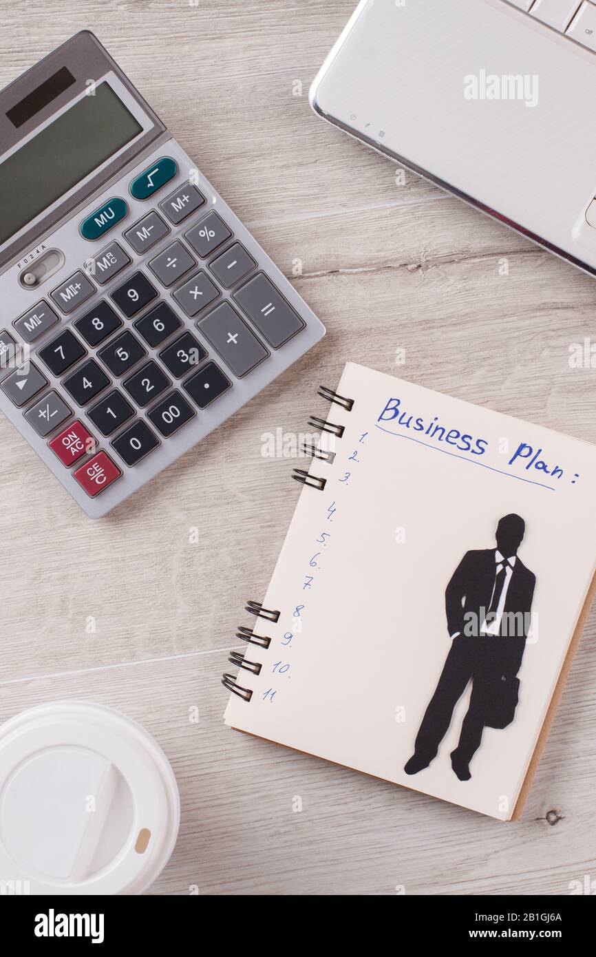 Calculator and notepad close up. Stock Photo
