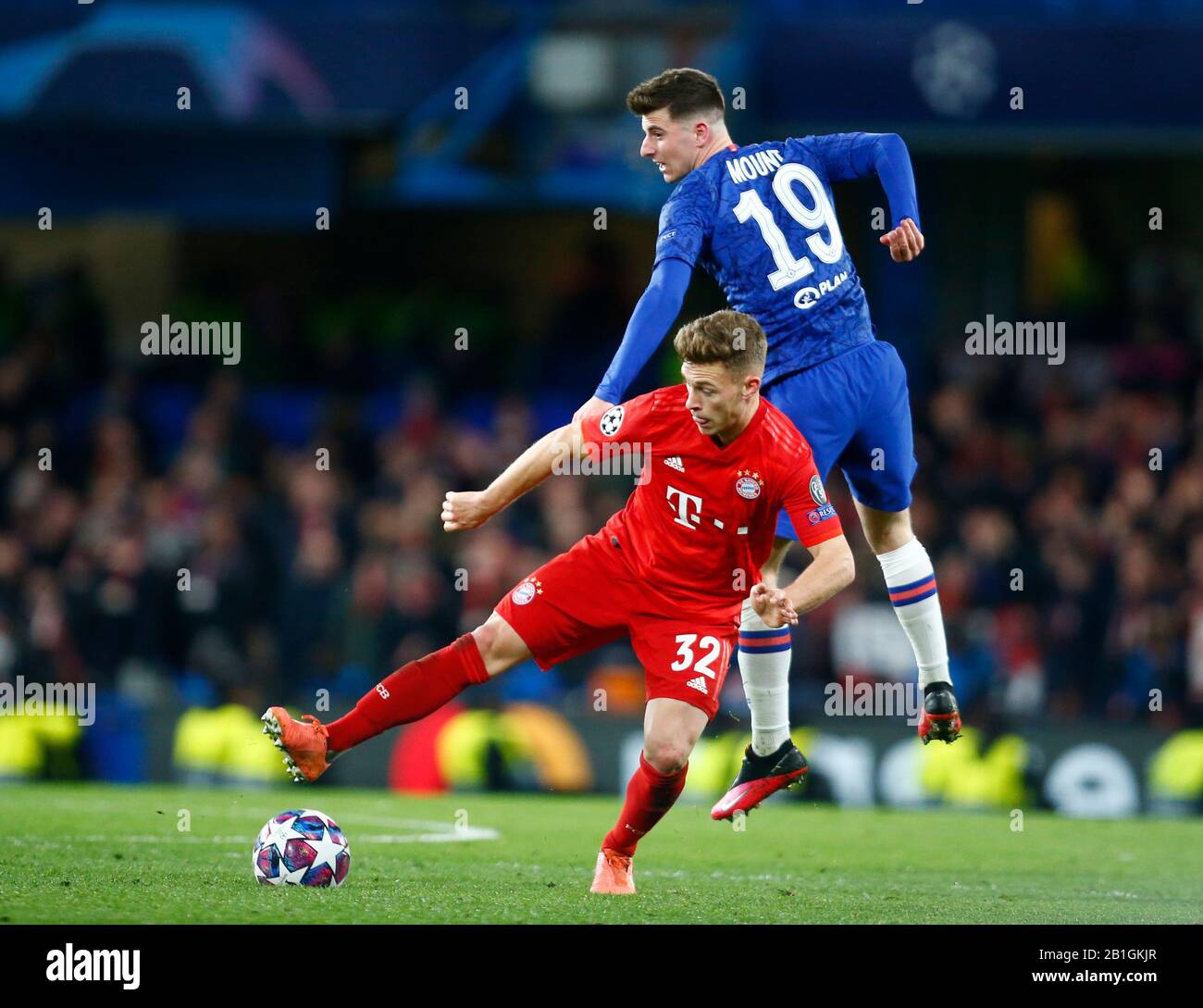 LONDON, UNITED KINGDOM. FEBRUARY 25 Joshua Kimmich of FC Bayern Munich and Chelsea's Mason Mount during Champion League Round 16 1st Leg between Chelsea and Bayer Munchen at Stanford Bridge Stadium, London, England on 25 February 2020 Credit: Action Foto Sport/Alamy Live News Stock Photo