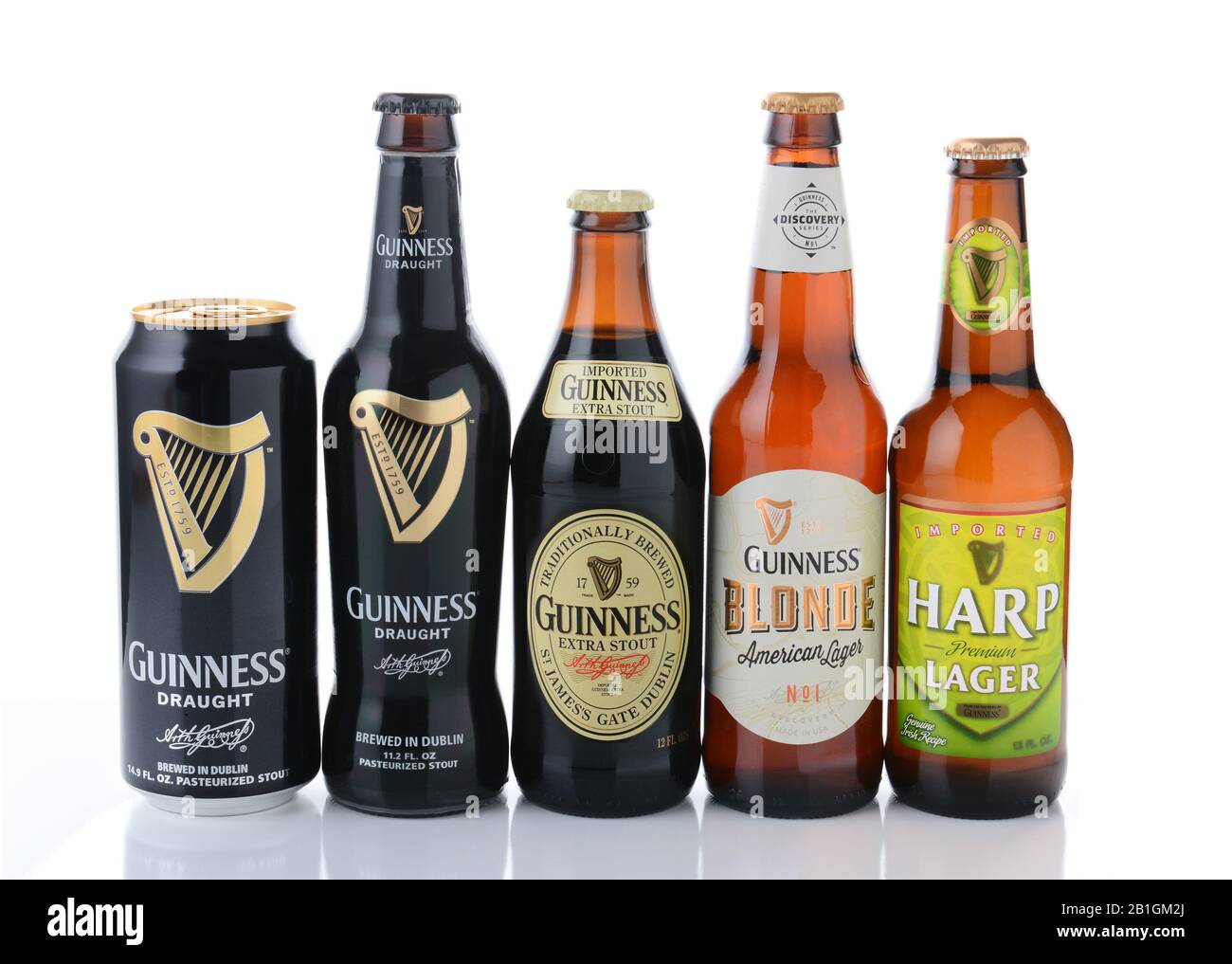 IRVINE, CA - JANUARY, 11, 2015: Five bottles of beer from the Guinness Brewing Company.  Guinness has been producing beer in Ireland since 1759. Stock Photo