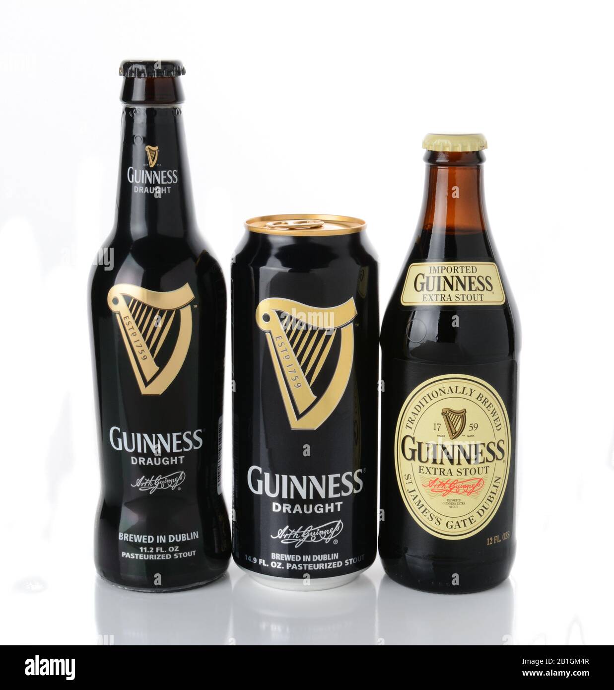 IRVINE, CA - JANUARY 12, 2015: Three beers from the Guinness Brewing Company, Stout bottle and Draught can and bottle.  Guinness has been producing be Stock Photo