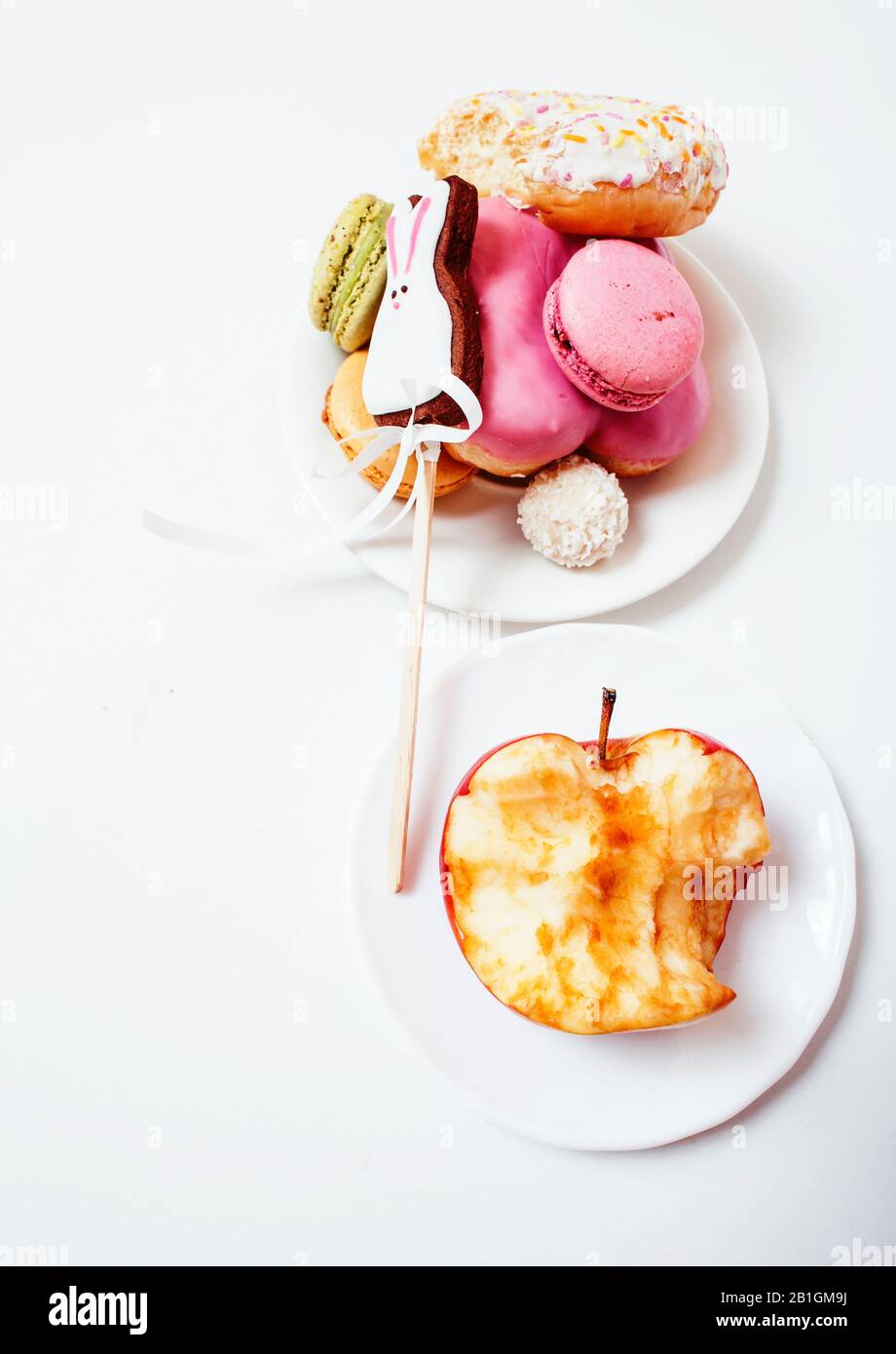 new real diet concept, question between red apple and donut with sweety ...