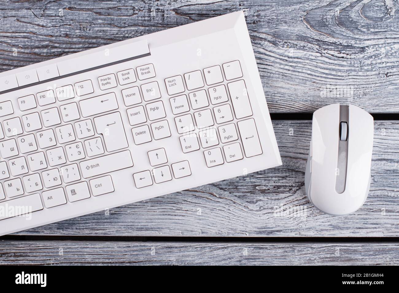 White keyboard and optical mouse on background. Stock Photo
