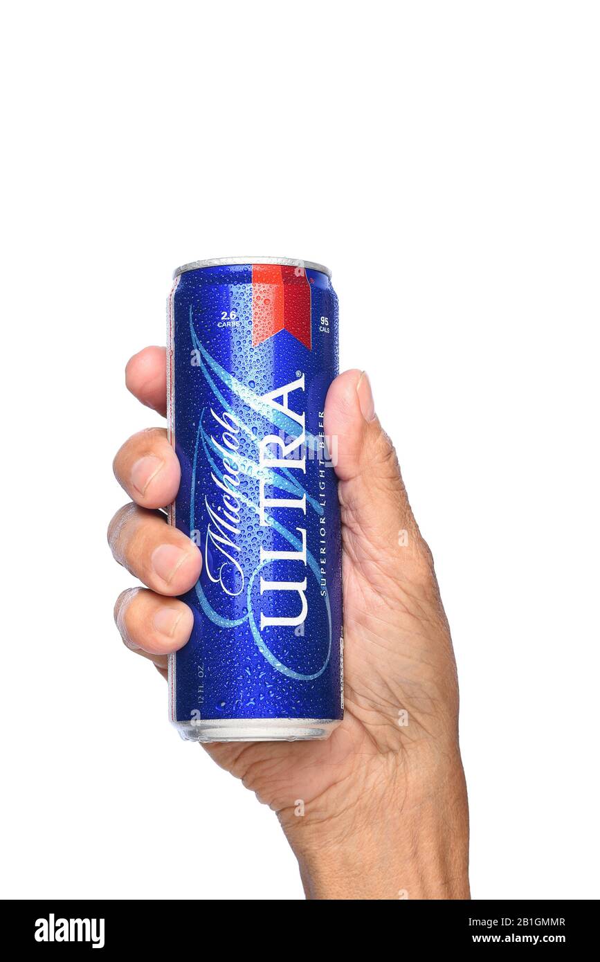 IRVINE, CALIFORNIA - APRIL 26, 2019: Closeup of a hand holding a can of Michelob Ultra Beer. A a low carb and low calorie light beer from Anheuser-Bus Stock Photo