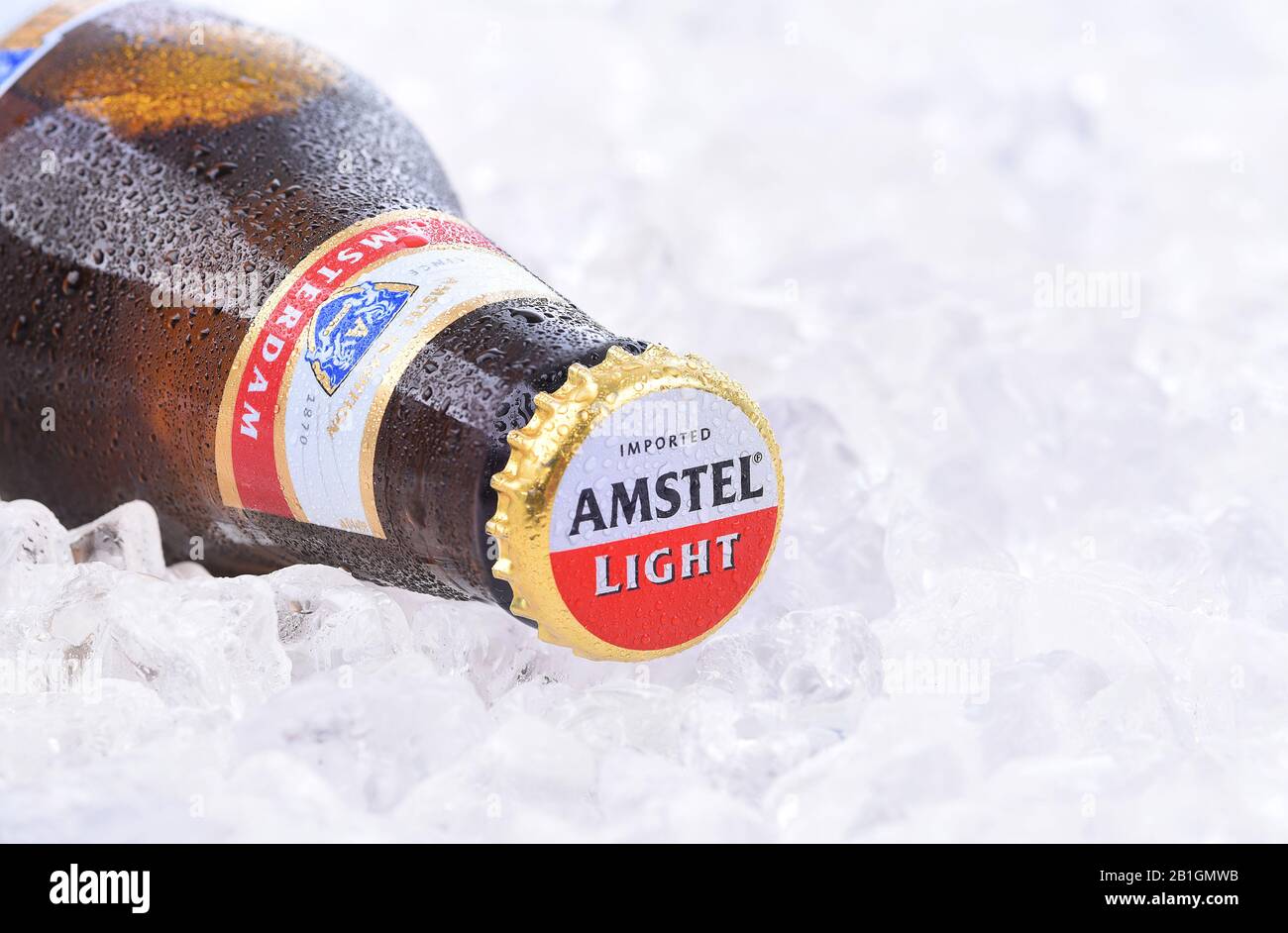 IRVINE, CA - AUGUST 26, 2016: A bottle of Amstel Light on a bed of ice. Founded in 1870 it was taken over by Heineken in 1968, produces over 36 millio Stock Photo