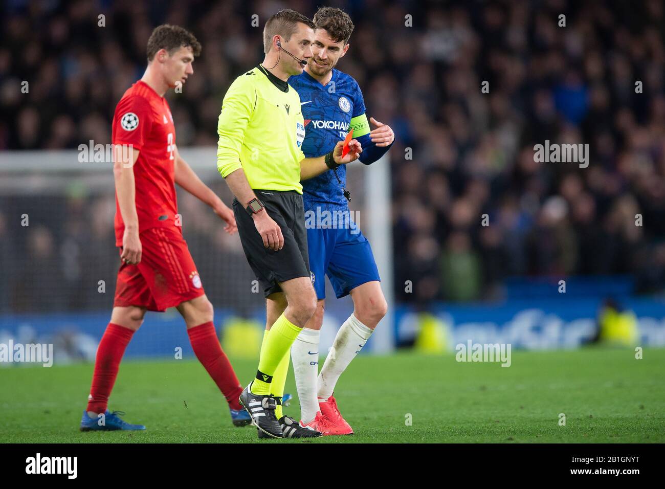 London, UK. 25th Feb, 2020. Jorginho of Chelsea talks with match referee Clement Turpin (FRA) after Marcos Alonso of Chelsea receives a red card after a VAR check during the UEFA Champions League Round of 16 match between Chelsea and Bayern Munich at Stamford Bridge, London, England on 25 February 2020. Photo by Salvio Calabrese. Editorial use only, license required for commercial use. No use in betting, games or a single club/league/player publications. Credit: UK Sports Pics Ltd/Alamy Live News Stock Photo