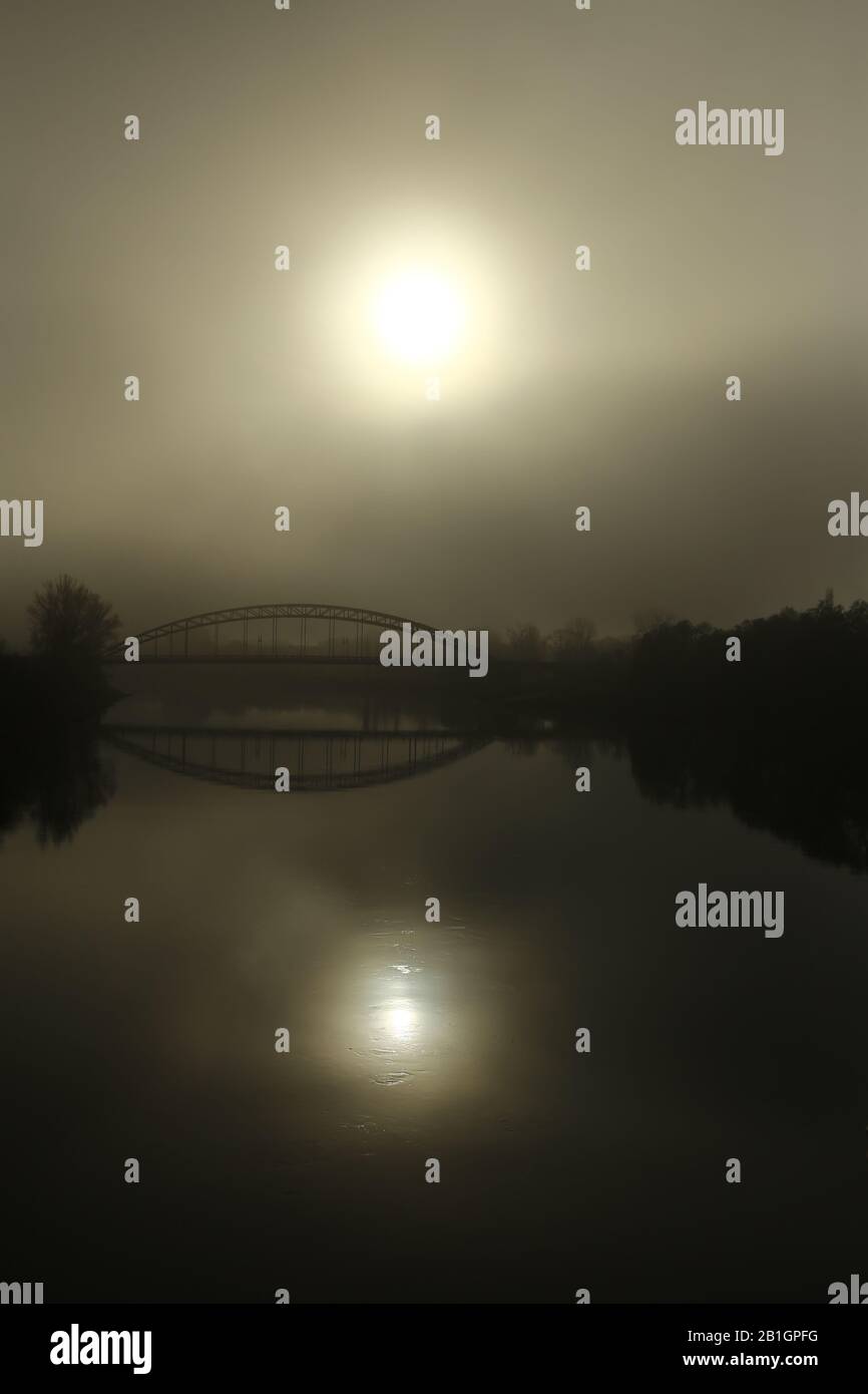 Sternbrucke (lit. star bridge) over misty river Elbe in Magdeburg. Stock Photo