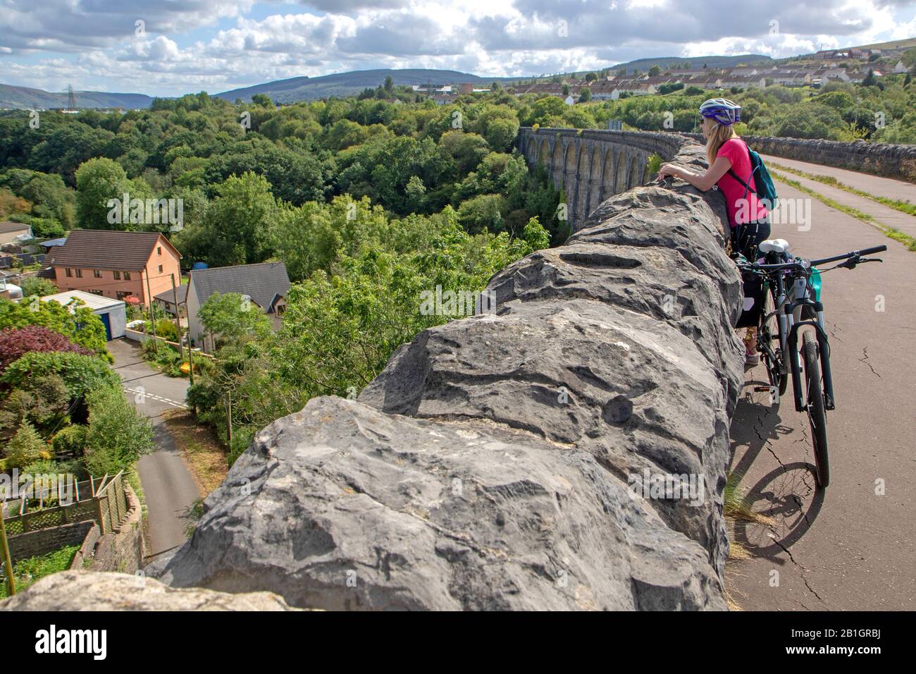 Cyclist on the Cefn Coed Viaduct at Merthyr Tydfil Stock Photo