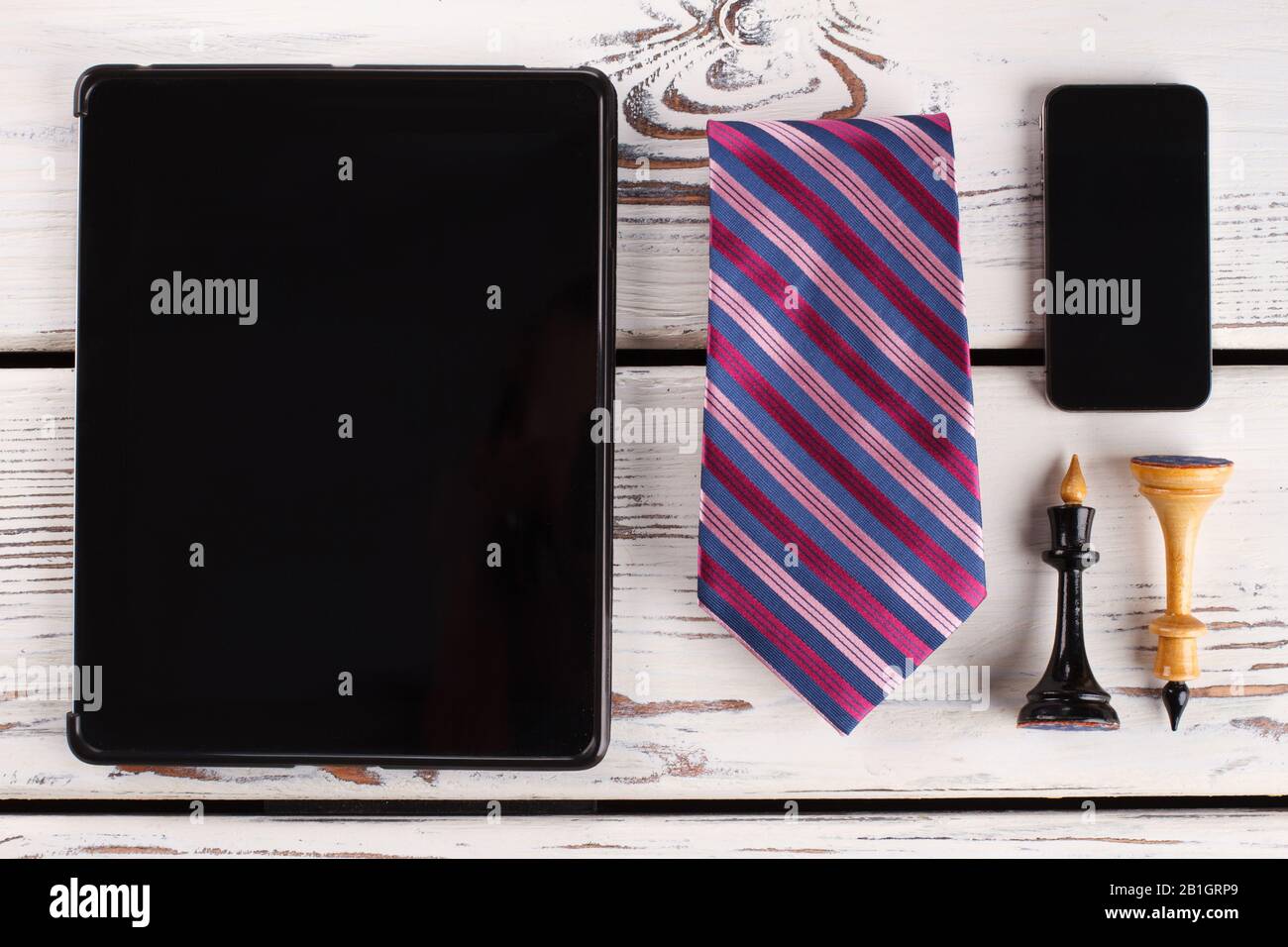 Chess figures, tie and devices. Stock Photo