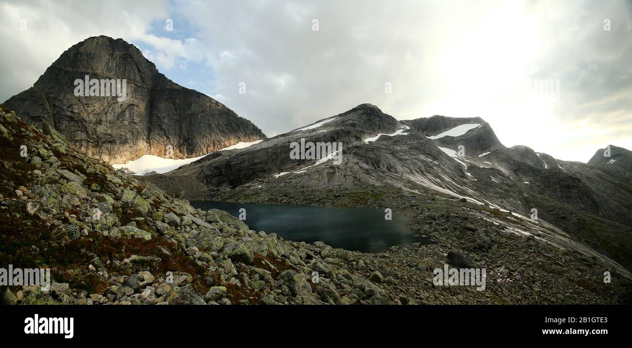 Panorama of mountain lake Svartvatnet at Norways national mountain Stetind. Stock Photo