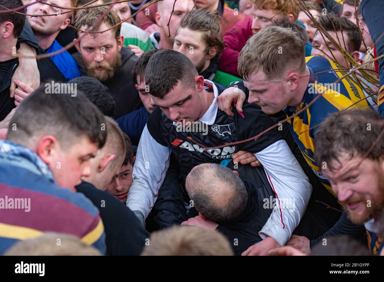 Ashbourne, UK. 25th Feb, 2020. The first day of the two day Shrovetide Football Game in the market town of Ashbourne, Derbyshire. The game is played with two teams, the Up'Ards and the Down'Ards. There are two goal posts 3 miles (4.8 km) apart, one at Sturston Mill (where the Up'Ards attempt to score), other at Clifton Mill (where the Down'Ards score). Penelope Barritt/Alamy Live News Stock Photo
