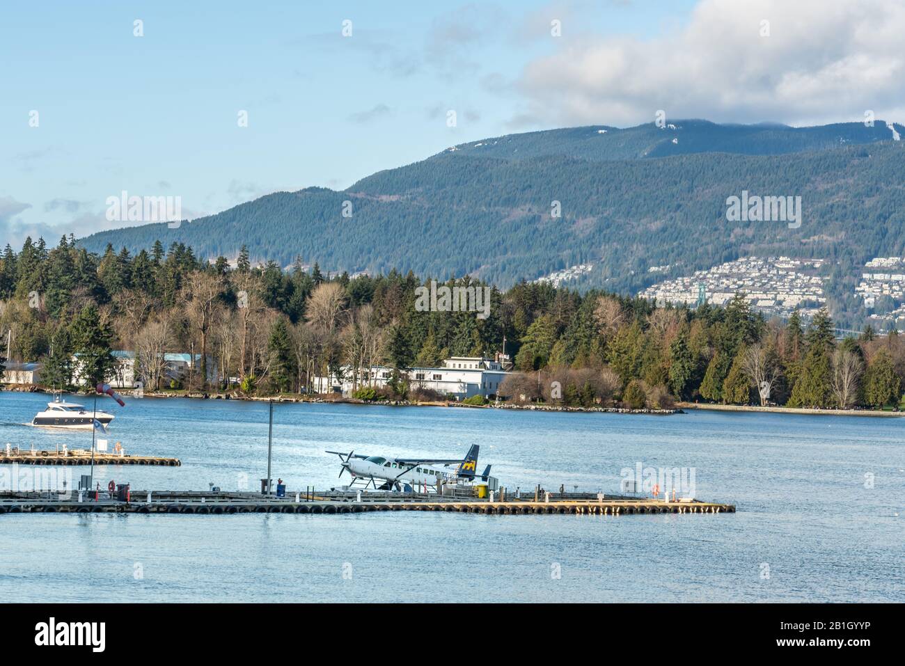 Vancouver, British Columbia, Canada - December, 2019 - Beautiful blue sky day at Canada Place, at West Coast seaport in British Columbia. Stock Photo