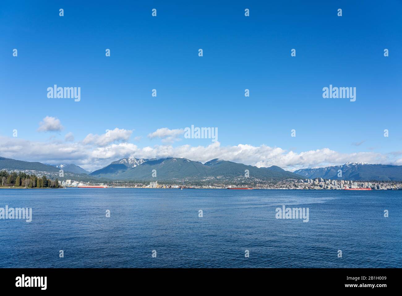 Mountain View from Canada Place with clouds in a Beautiful blue sky day at West Coast seaport in Vancouver, British Columbia, Canada. Stock Photo
