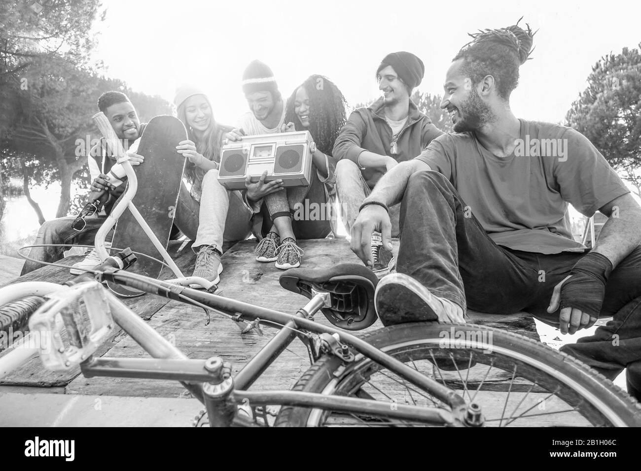Happy friends listening music in new york skate city park 