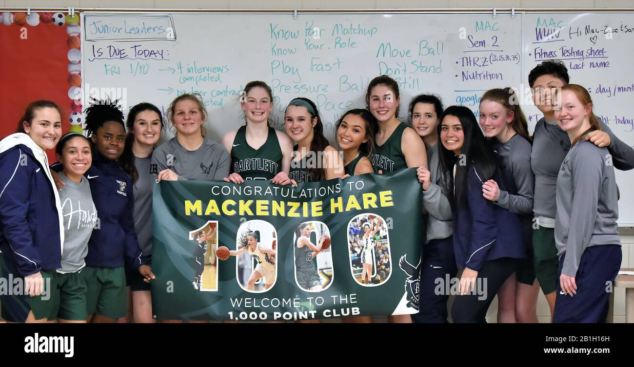 Player celebrated with her teammates while commemorating scoring 1,000 points during the a just completed game. USA. Stock Photo