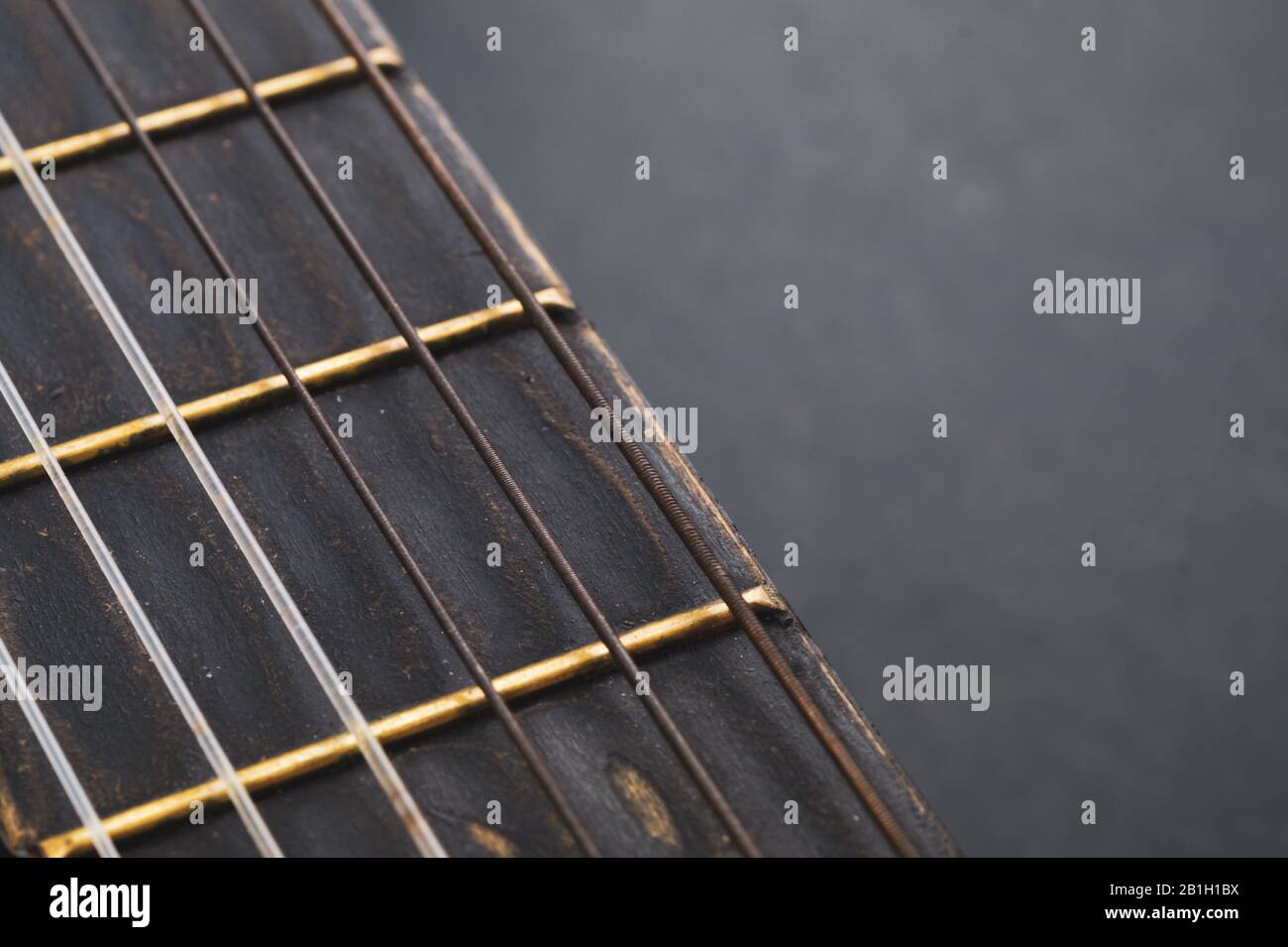 Acoustic guitar neck close up. guitar strings macro. musical instrument Stock Photo