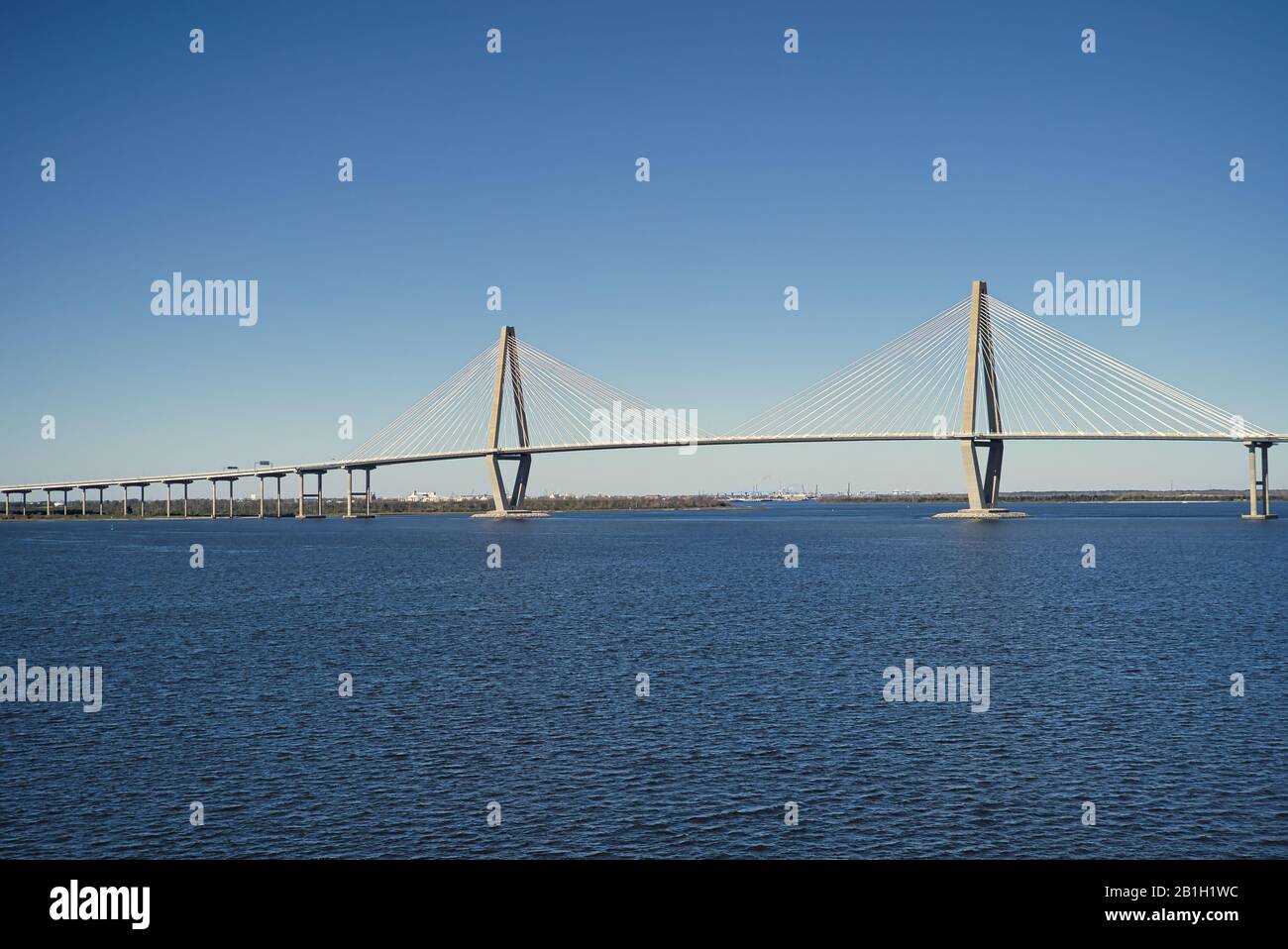 Architecture suspension highway bridge that spans the ocean with a blue