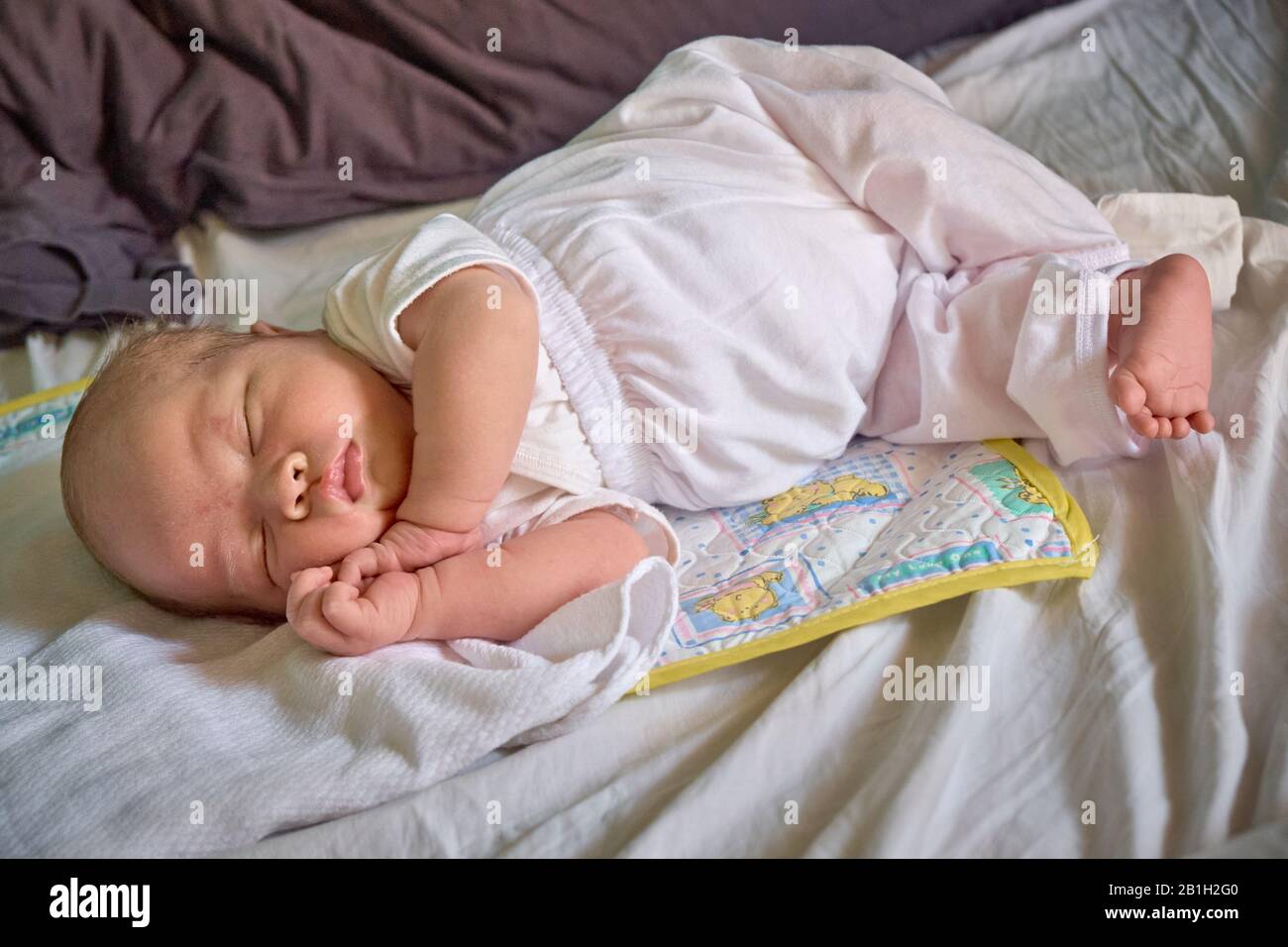Young infant boy sleeping Stock Photo Alamy