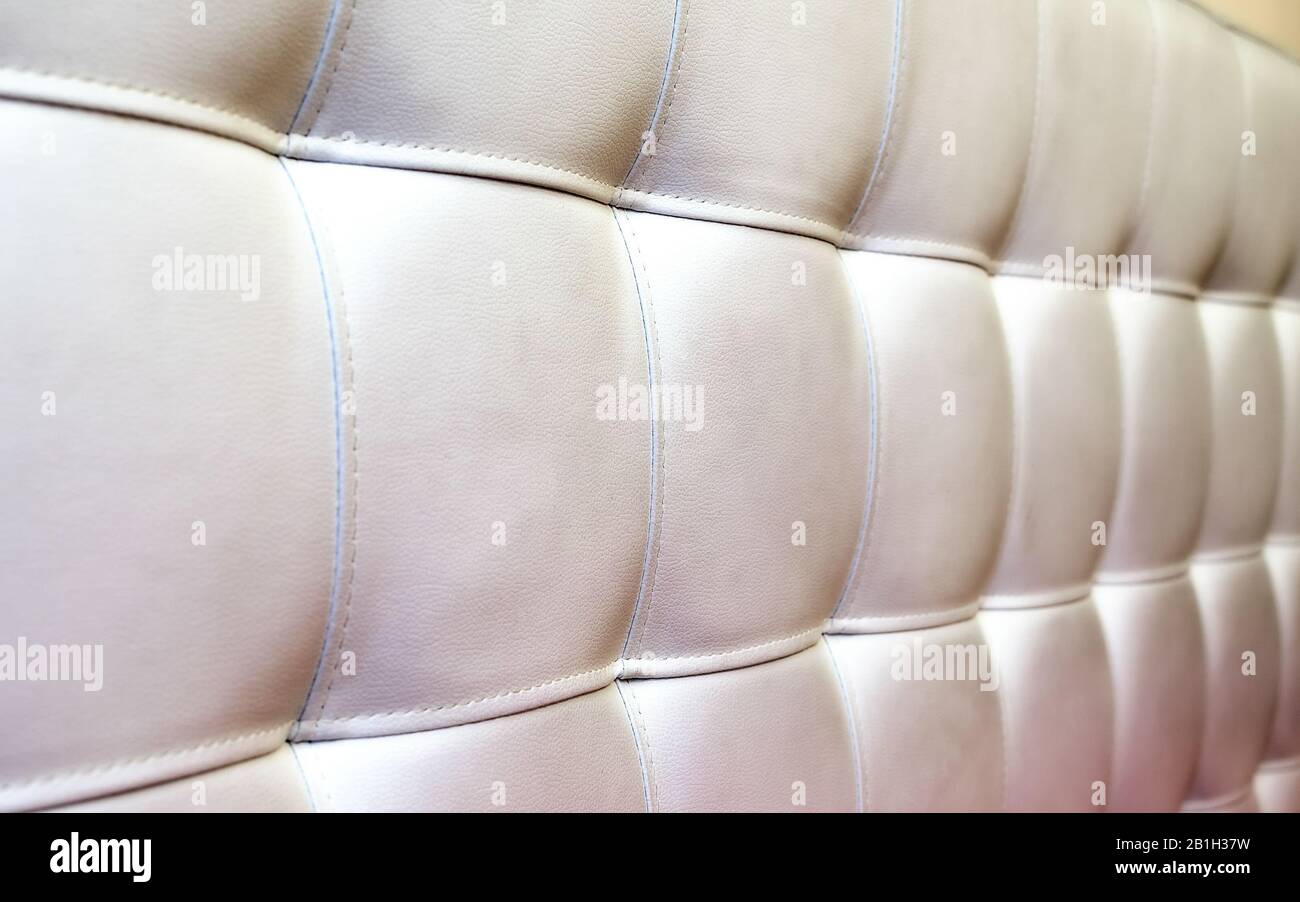 Tufted white leather headboard texture, used for background Stock Photo