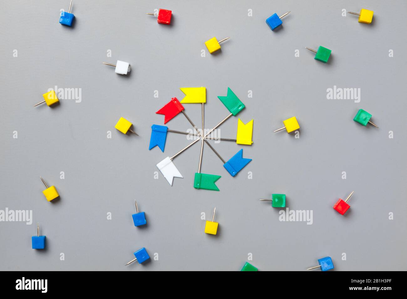 Colorful push pins isolate on gray background Stock Photo