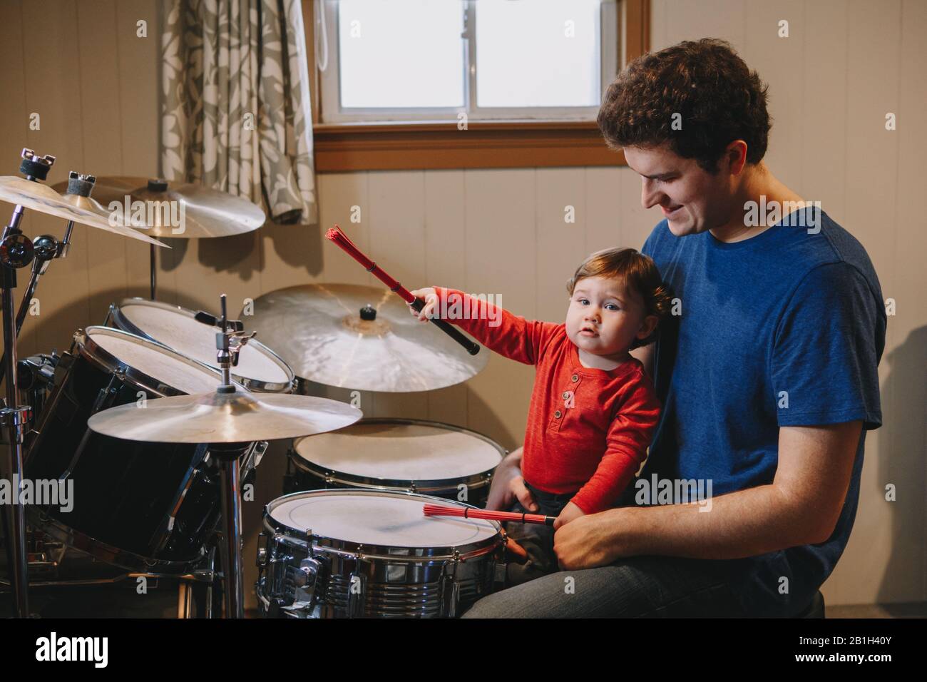 Father Teaching Baby Boy To Play Drums Parent With Toddler Child Having Fun And Spending Time Together Dad And Kid Playing Music Family Hobby Activ Stock Photo Alamy