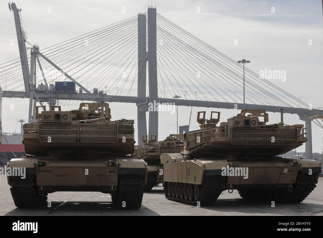 Soldiers assigned to 2nd Brigade Combat Team wait to move M1A1 Abrams tanks aboard a military transport vessel in support of DEFENDER-Europe 20 at the Port of Savannah, Ga. February 12, 2020.      DEFENDER-Europe 20 is the deployment of a division-size combat-credible force from the United States to Europe, the drawing of equipment and the movement of personnel and equipment across the theater to various training areas. U.S.-based equipment will leave from ports in four states and arrive in six European countries. This will require the support of tens of thousands of service members and civili Stock Photo