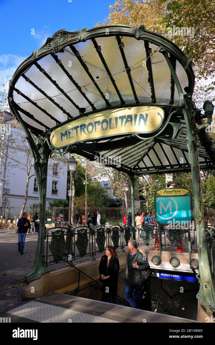 The Art Nouveau style entrance of Abbesses metro station with the original glass-covered 'dragonfly' (édicules) designed by Hector Guimard at Montmartre.Paris.France Stock Photo
