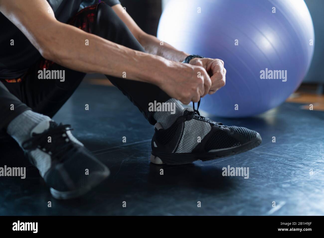 Man hand tying shoelace Stock Photo - Alamy - Flexible Shoelace Solution For Hand Dexterity Limitations