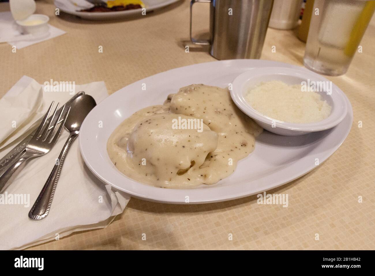 Southern biscuits with country gravy and corn grits Stock Photo Alamy
