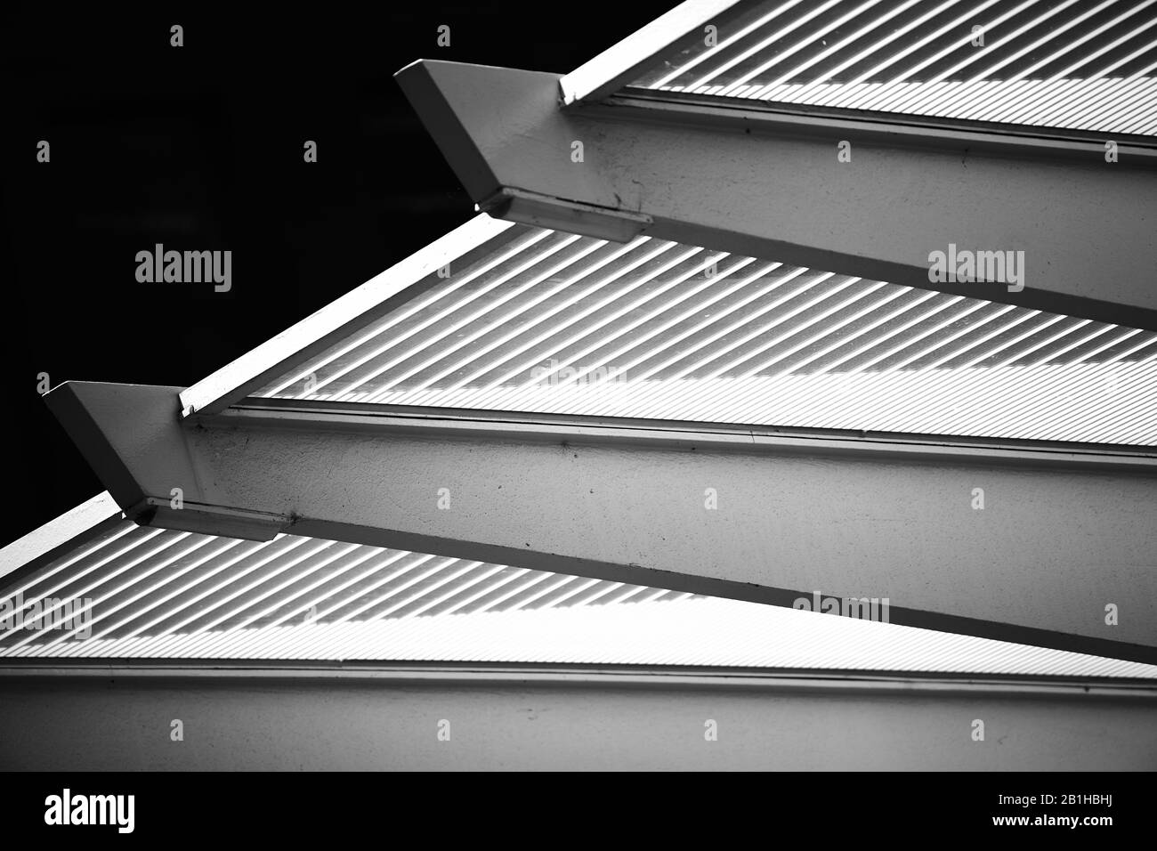 Close up of metal structure above train stop viewed from below Stock Photo