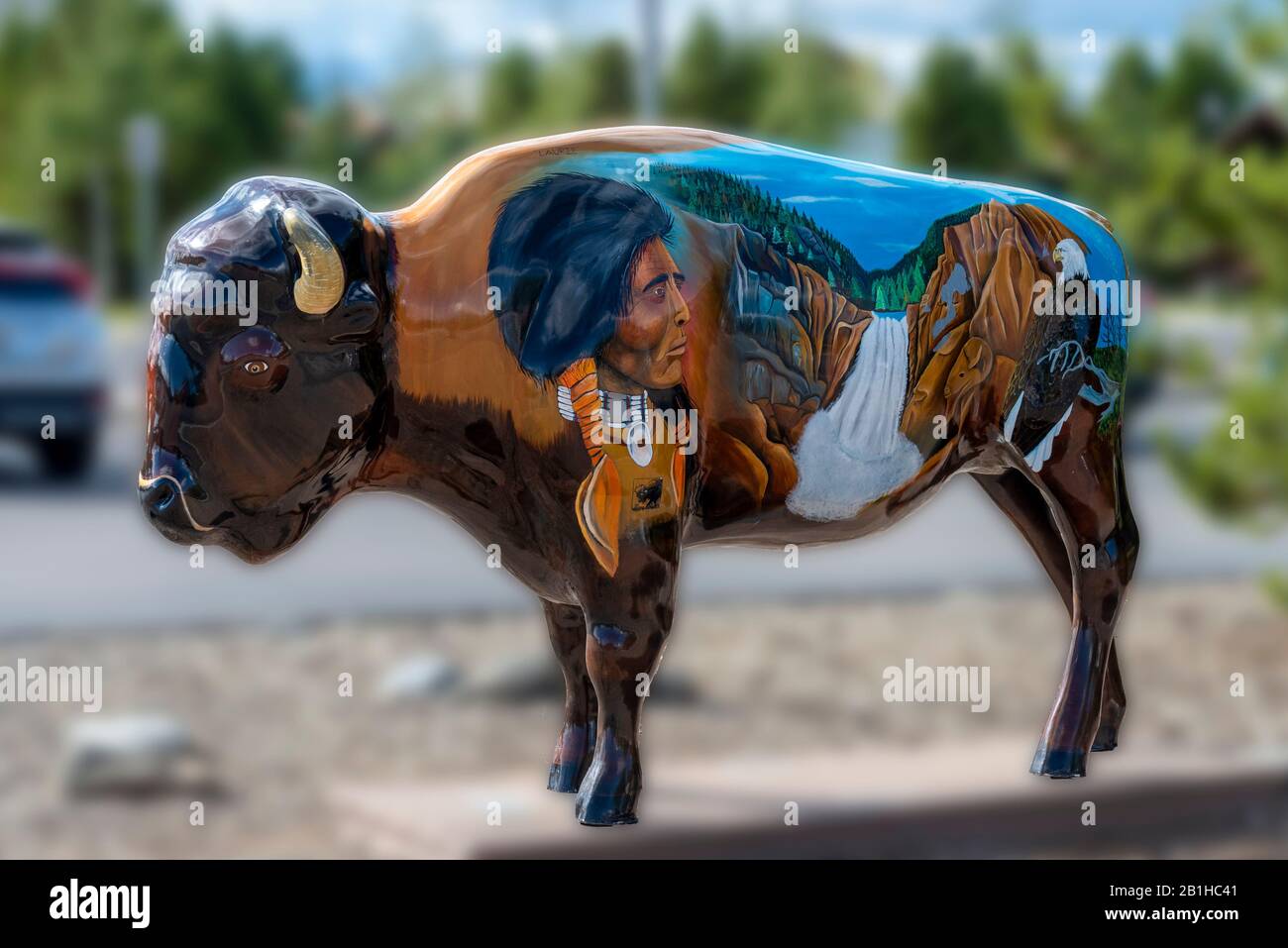 Buffalo statue painted with scenes from Yellowstone National Park, and