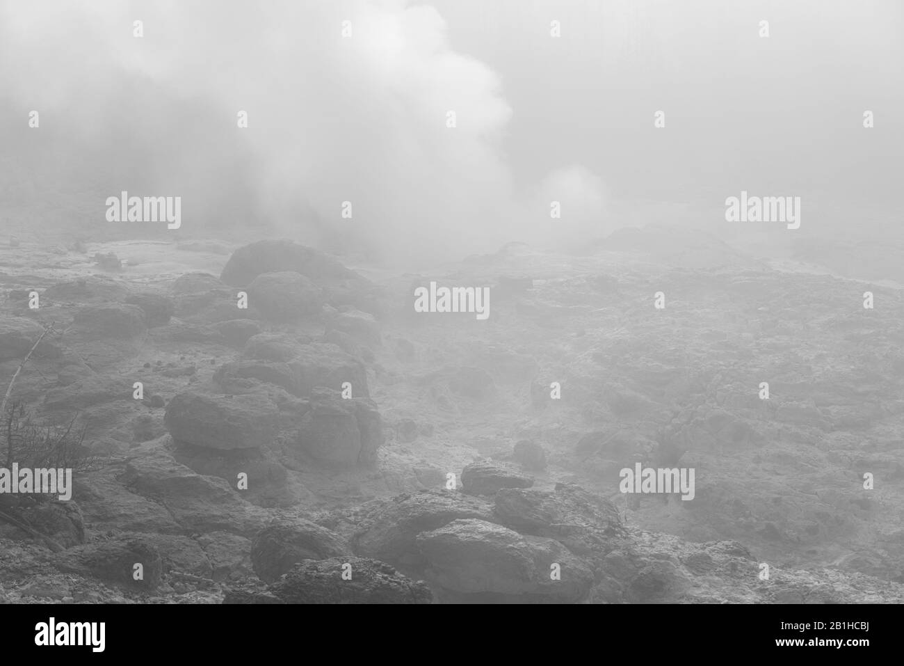 Hot gases venting from alien looking landscape, gives the viewer a feeling of dread. Stock Photo
