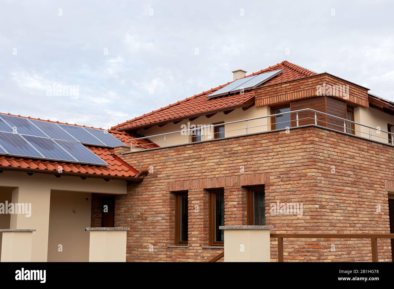 Modern house with solar panels on the roof Stock Photo - Alamy