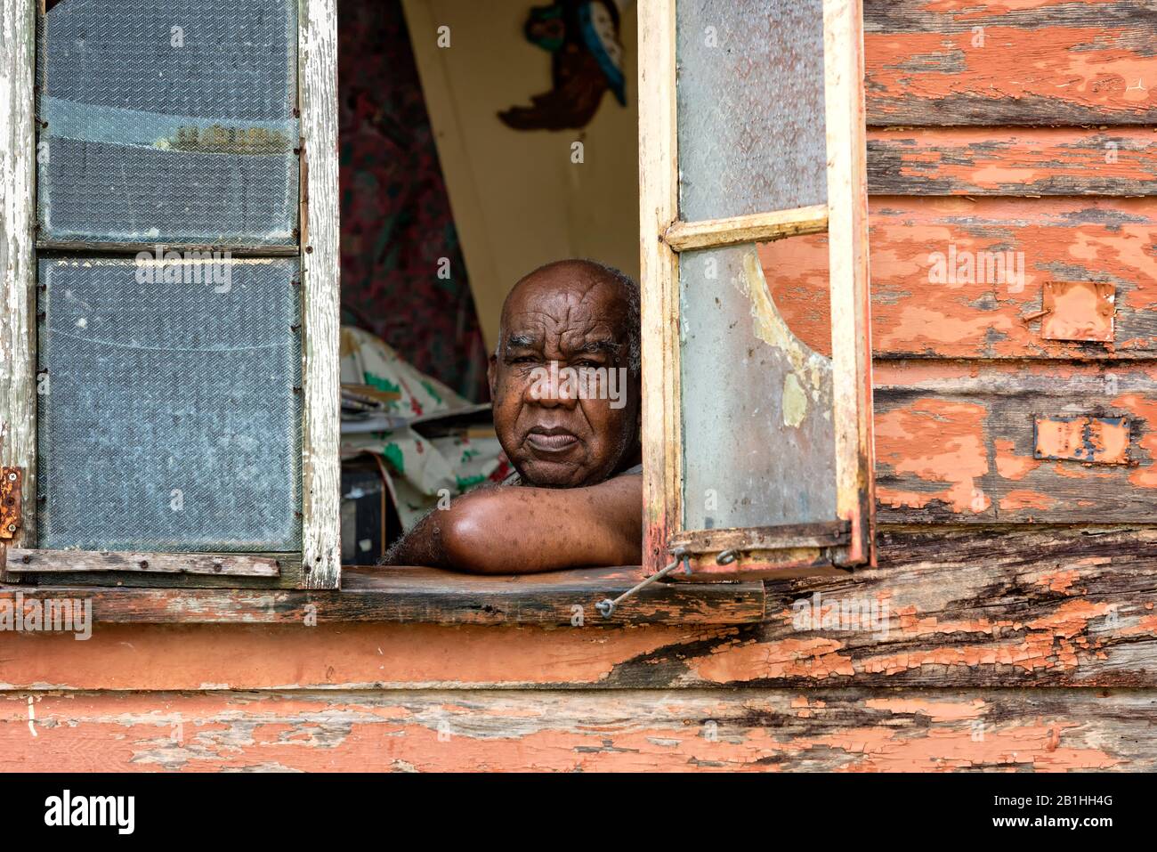 Wooden shanty houses on the Caribbean island of Barbados, peeling paint, culture, lifestyle, off the beaten track, hard lives, poor life, surviving Stock Photo