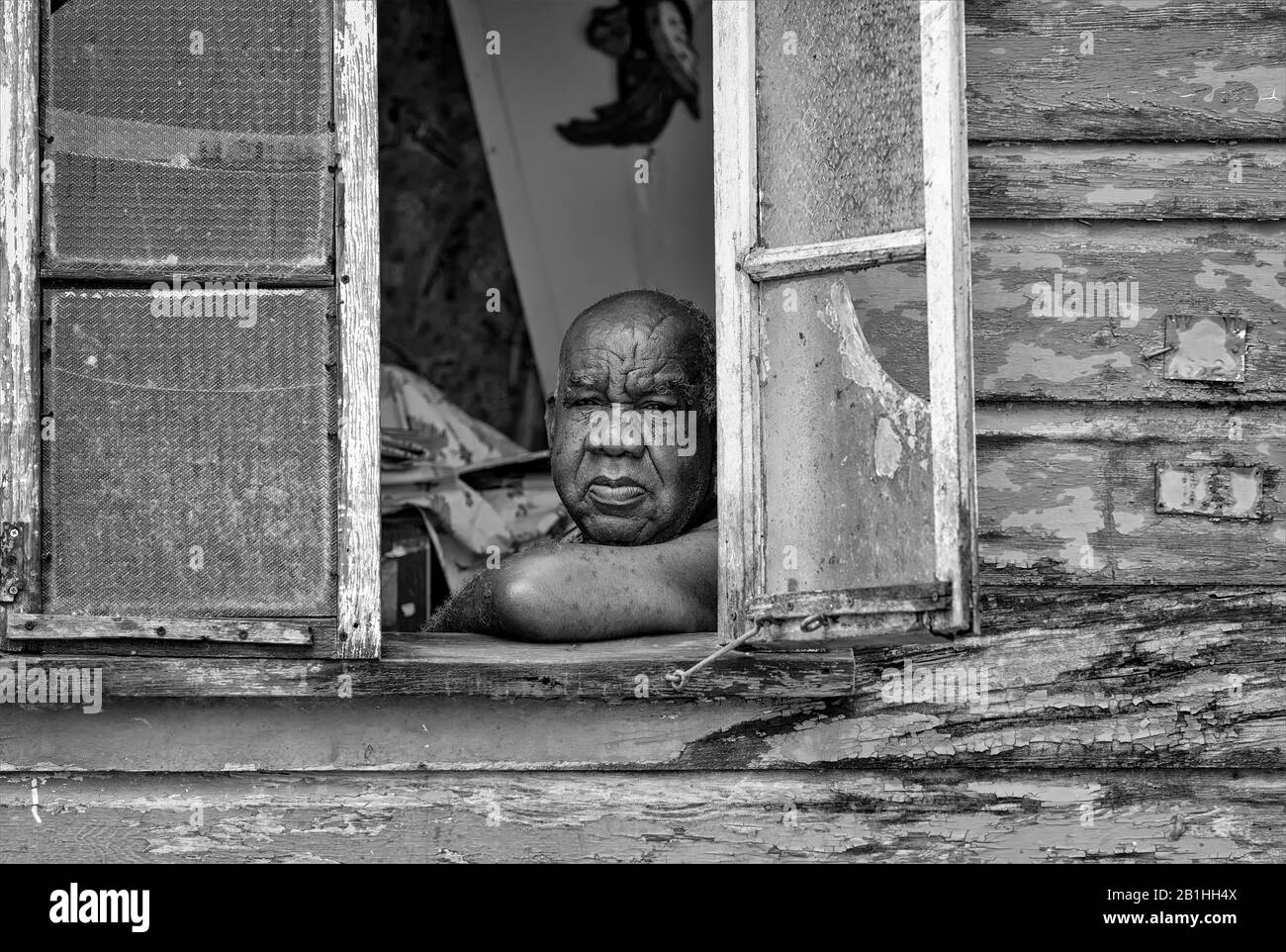 Wooden shanty houses on the Caribbean island of Barbados, peeling paint, culture, lifestyle, off the beaten track, hard lives, poor life, surviving Stock Photo