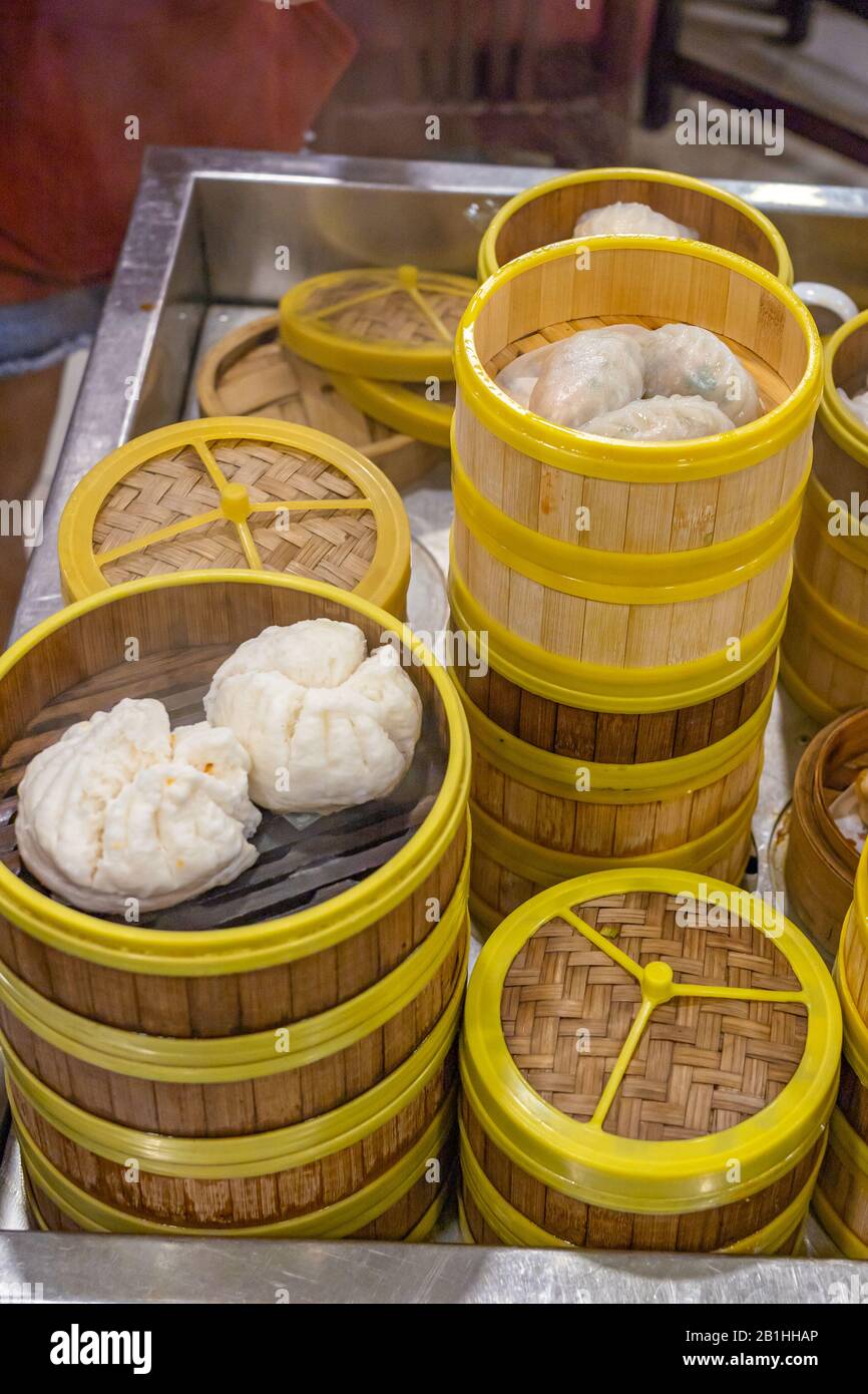 Steamed dumplings in dimsum steamer boxes in Hong Kong restaurant Stock