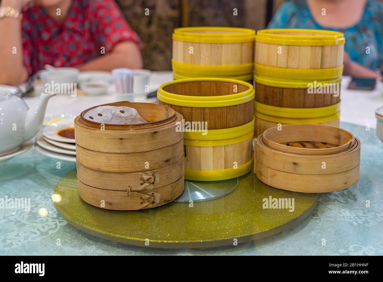Hong Kong dimsum bamboo steamer boxes on table in restaurant Stock Photo