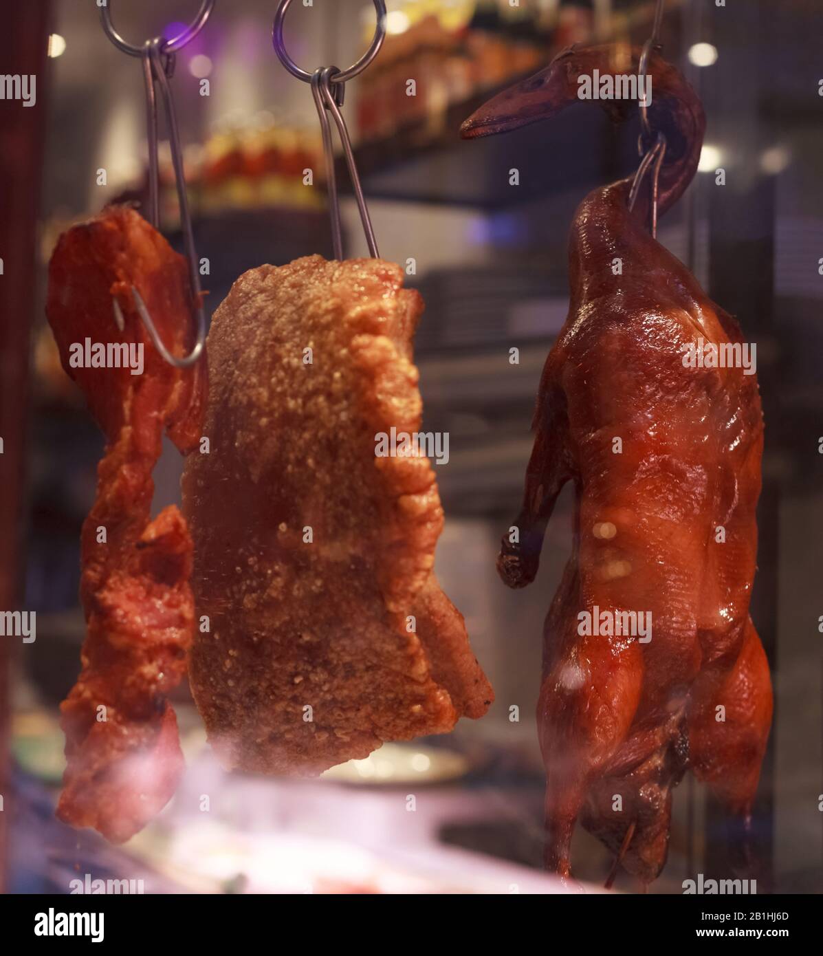 Barbecue Grill Duck hung on display in food box at market stall