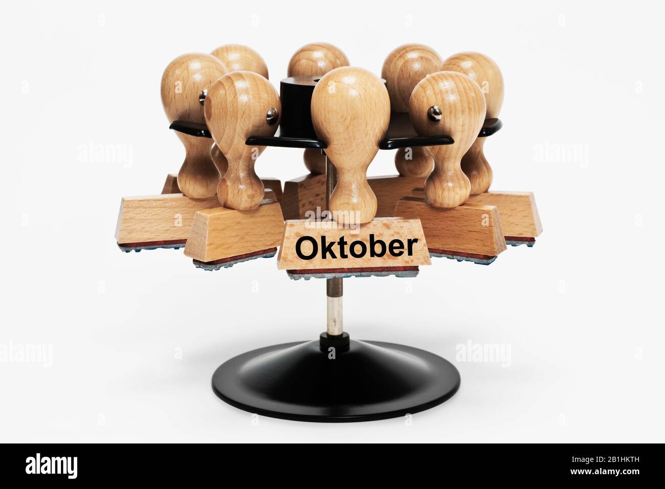 a stamp with the inscription Oktober (October) hangs in a stamp rack Stock Photo