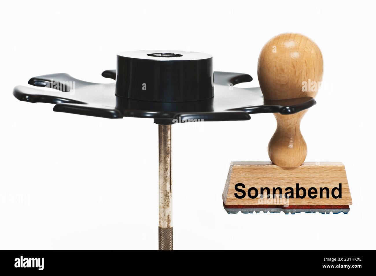 a stamp with the inscription Sonnabend (Saturday) hangs in a stamp rack Stock Photo