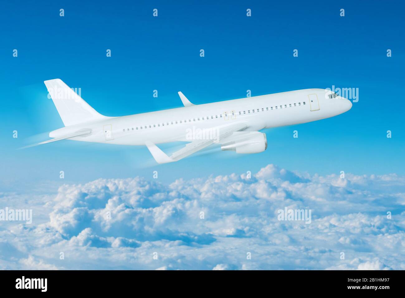 Airplane flying in the sky Stock Photo - Alamy