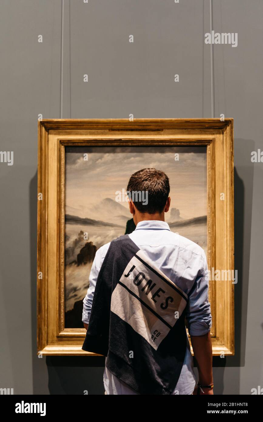Hamburg, Germany - August 4, 2019: Teenager looking at painting in Hamburger Kunsthalle museum Stock Photo