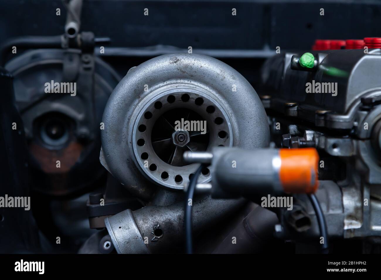 Turbo charger installed on car engine for power booster torque drive. Auto service industry for racing. Stock Photo